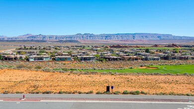 View of mountain backdrop featuring nearby suburban area