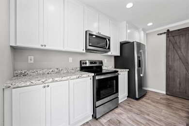 Kitchen featuring light hardwood / wood-style floo