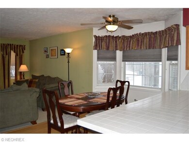 The dining area offers a pretty bayed window, whic