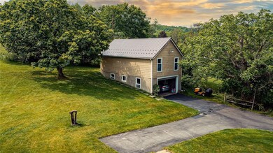 Oversized 4 car garage also has an equally large w