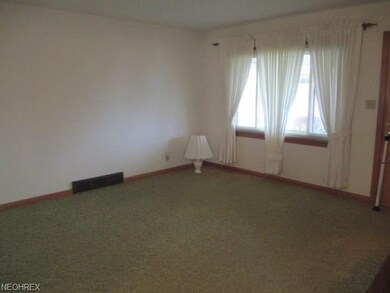 Living room with new windows and hard wood floors 