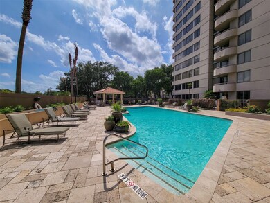 Huge pool with lots of decking and lounge chairs!