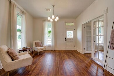 Spacious living area with wood floors.
