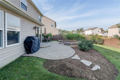 Custom paver-patio with built-in fire pit and seating.  Plenty of room for friends and family!