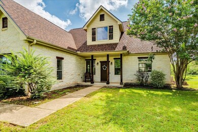 View of front of house featuring stone siding, ro