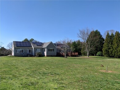 REAR OF HOME WITH LARGE DECK