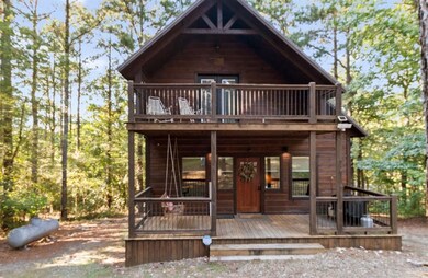 Chalet / cabin with a wooden deck