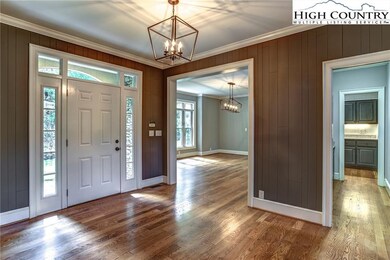 Natural light pours into the spacious foyer,