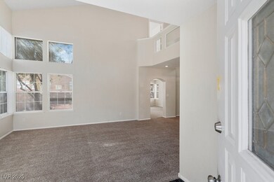 Unfurnished room featuring baseboards, carpet floo