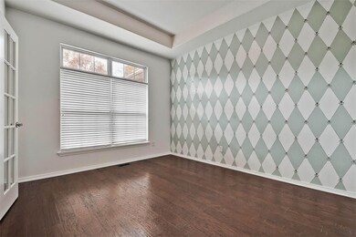 Dining room has a 9 ft. trey ceiling with an accent wall.