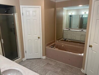 Bathroom featuring vanity, ornamental molding, and