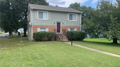 Bi-level home with a front lawn