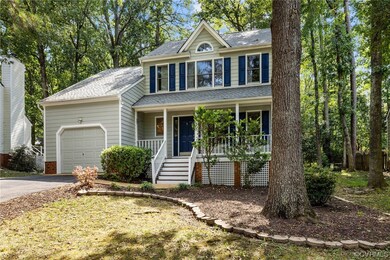 View of front of property featuring garage and a p
