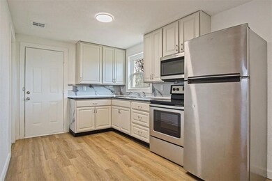 Kitchen featuring visible vents, light wood-style 