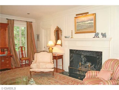Living Room - Fireplace has paneled chimney breast