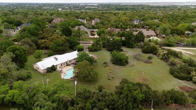 Aerial view featuring a view of trees