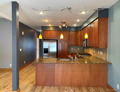Solid granite counters, wood cabinets and stainless appliances.