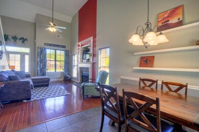 The open floor living area is perfect for entertaining. You can easily be in the kitchen and have guests enjoying appetizers at the breakfast bar, the dining area, or in the living room all while enjoying your company.