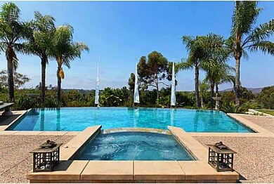 Large outdoor entertaining area with pool and spa.