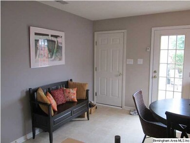 This cozy area in the dining room shows the door l
