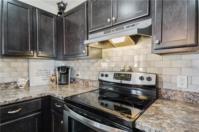 Gorgeous new cabinets and subway tile backsplash. 