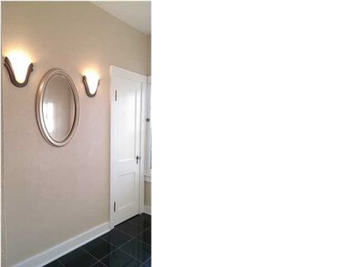 Foyer with Sconces and Coat Closet