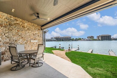 View of patio / terrace with a water view, a boat