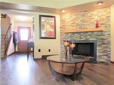 The corner wood burning fireplace has been updated