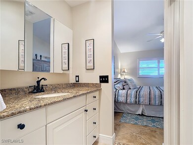 Bathroom with ceiling fan and a tile shower