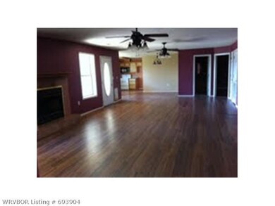 Living Room. Living room with a fireplace connects to the dining and kitchen - very open concept