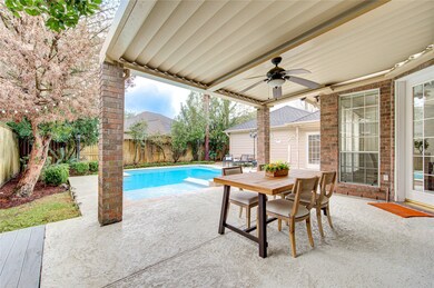 The private swimming pool and covered patio offer