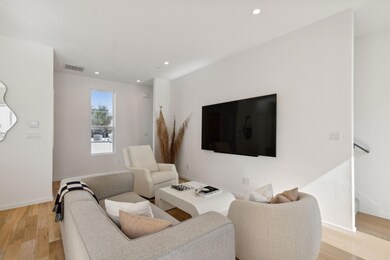 Living room with light wood-type flooring