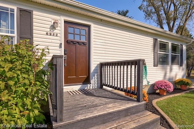 View of exterior entry featuring a deck