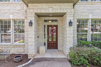 Doorway to property with stone siding