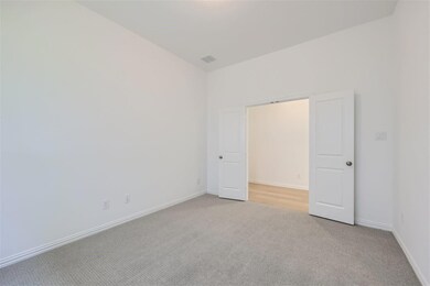Unfurnished bedroom with carpet flooring