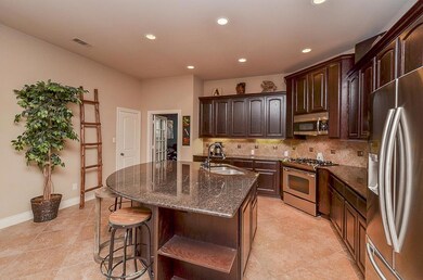 Kitchen features stainless steal appliances. Fridge is included