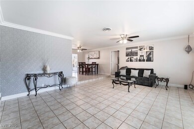 Living room featuring wallpapered walls, visible v