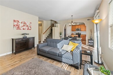 Open floor plan, the living room is light and bright with new flooring, gas fireplace, and large entertaining space.