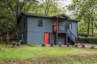 View of front facade with stairway and board and b