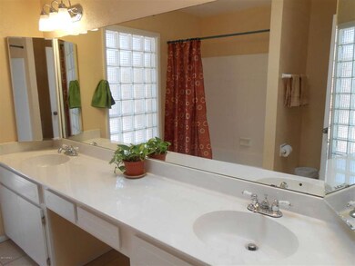 Glass block lights up the hall bath