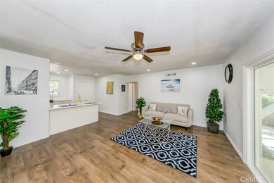 Kitchen opens up to the living room.  Kitchen counter also serves as a breakfast bar.