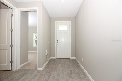 What a warm and inviting foyer entrance with a gra