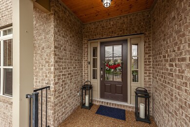 Notice the beautiful wood ceiling adorning the portico.