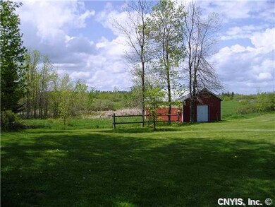 Barn. Barn, land extends way back and way to the r