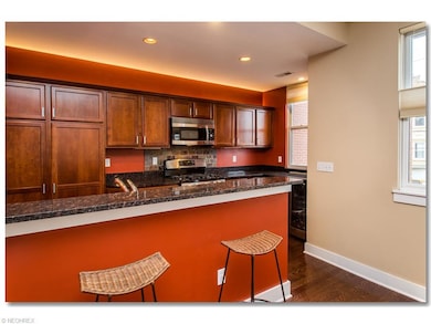Upgraded Kitchen with Granite Counters, Breakfast Bar, Hardwood Floors and All Stainless Steel               Appliances
