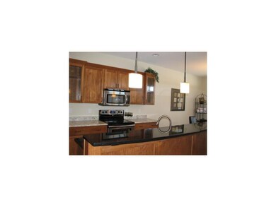 Kitchen. Hickory Cabinets accented by Grainte coun