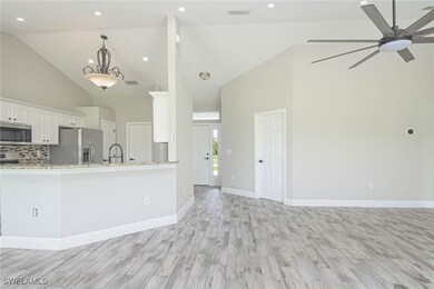 Kitchen featuring light wood-type flooring, ceilin
