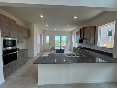 Kitchen with appliances with stainless steel fini