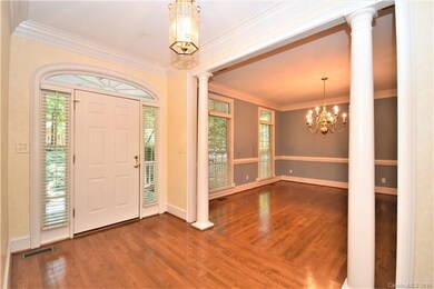 Elegant columns frame the formal Dining Room.  Tra