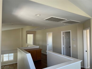 Hallway featuring an upstairs landing, baseboards,